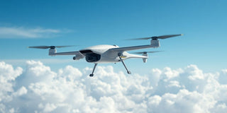 Futuristic UAV flying in a clear blue sky.