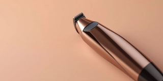 Sleek nose hair trimmer on a neutral background.