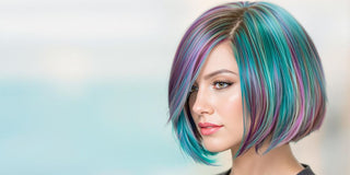 Trendy bob haircut on a model with vibrant colors.