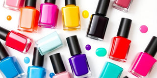 Colorful nail polish bottles on a white background.