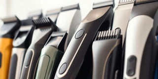 Various high-quality hair clippers on a blurred background.